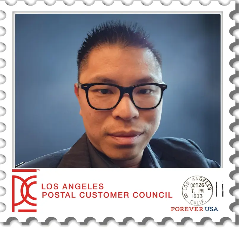 Man in glasses on a postal stamp.